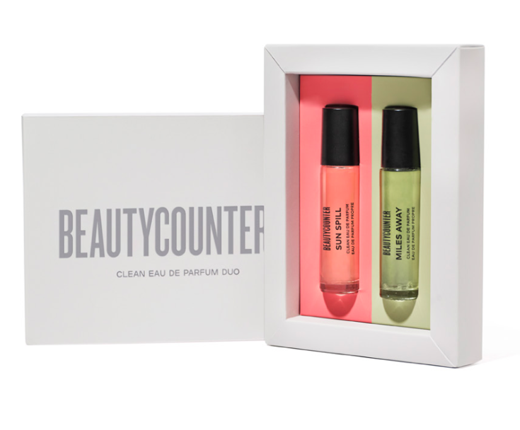 two perfume rollers in a white Beautycounter box